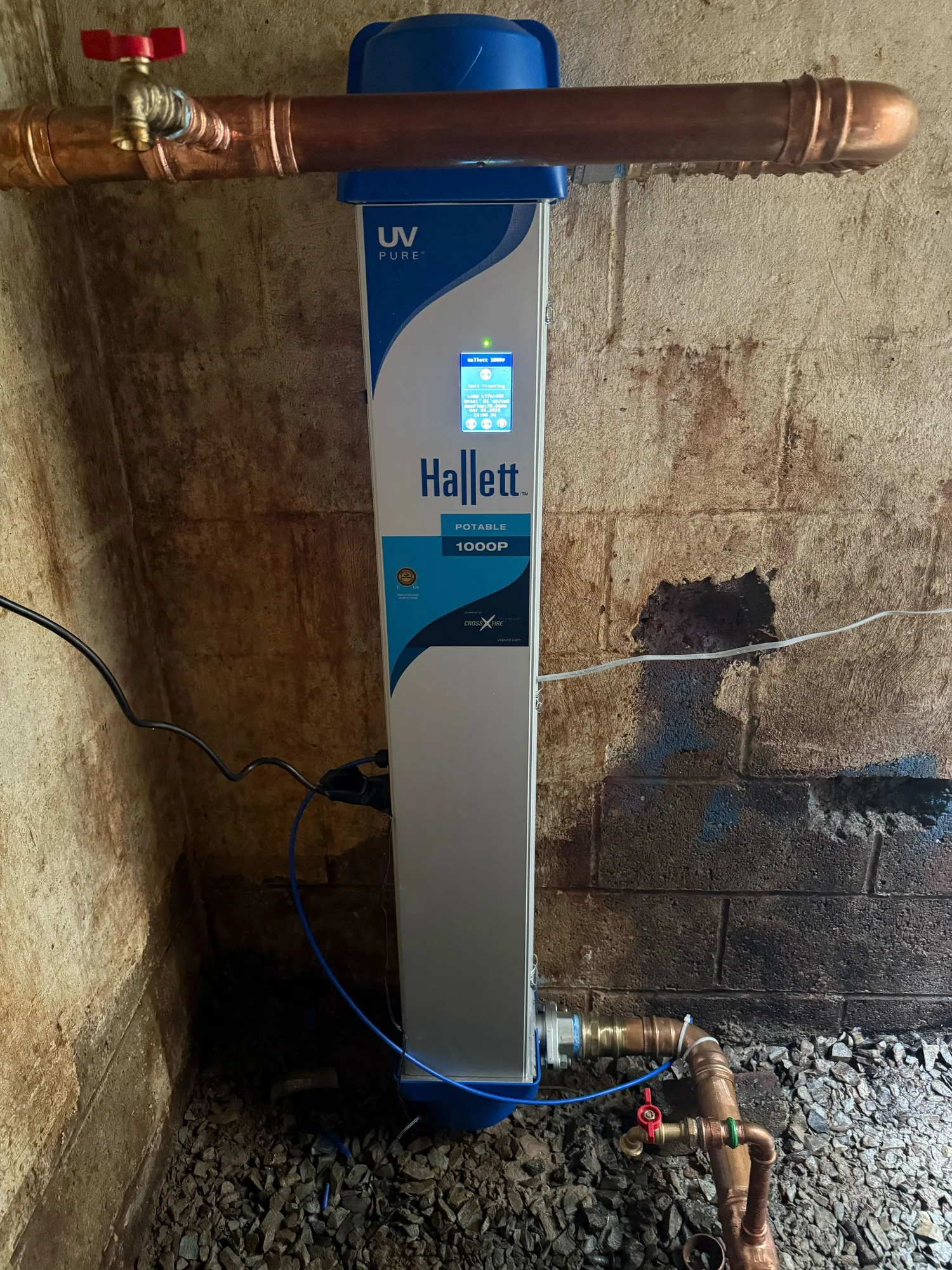 The UV system installed at the point of entry, with sampling ports before and after treatment